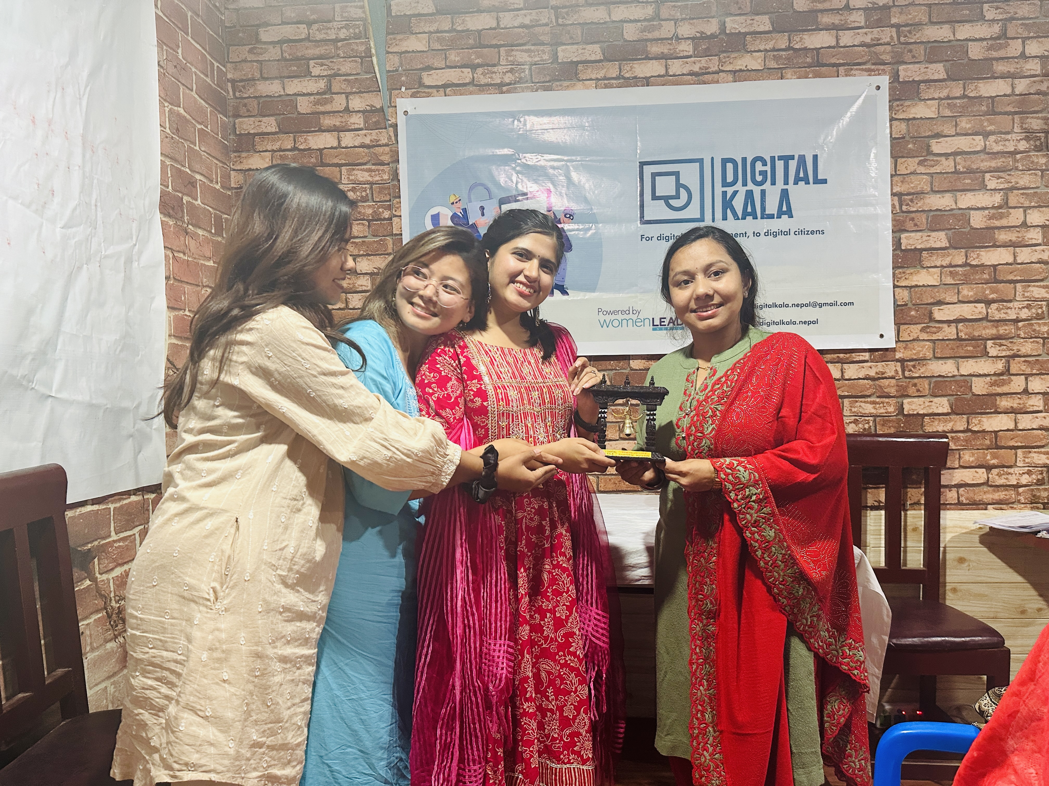 Digital Kala team receiving a token of appreciation from the Rotaract Club of Kapilvastu