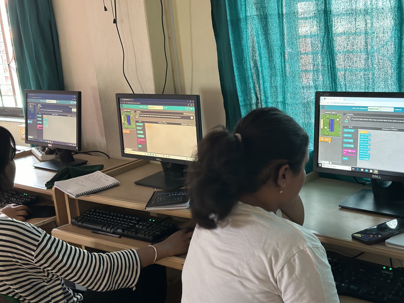 Students learning Scratch programming during a Digital Kala workshop