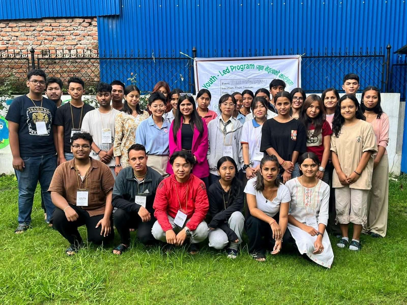 The 30 young participants from Chautari Youth Club with the Digital Kala team in front of the Youth-Led Program banner